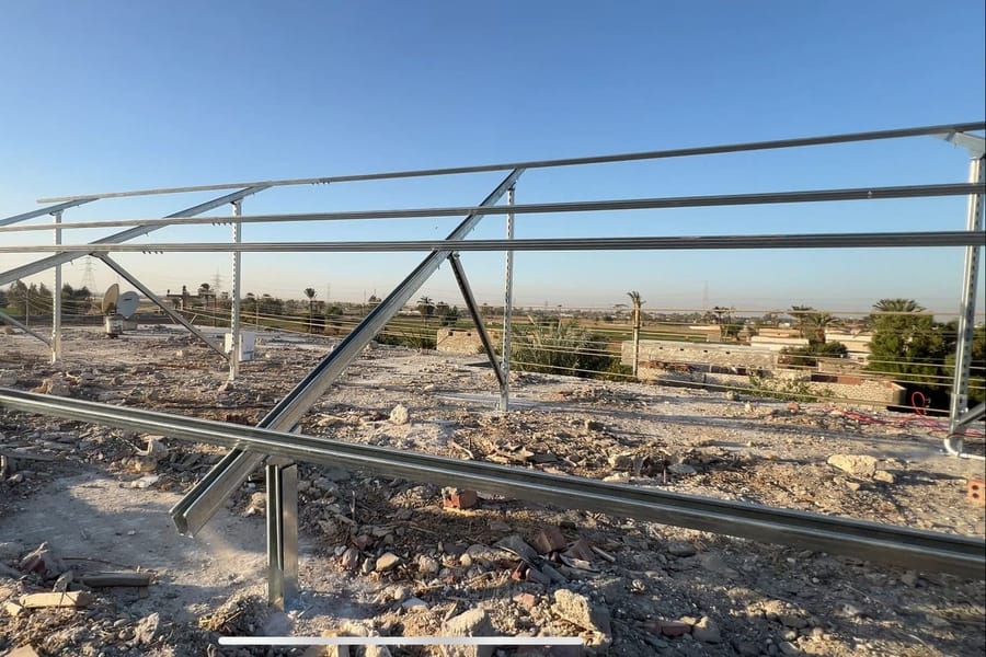 Solar array frame for a village station